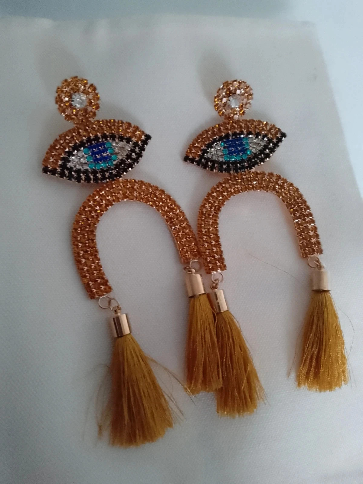 Boucles d'oreilles gypsy oeil, strass et pompons